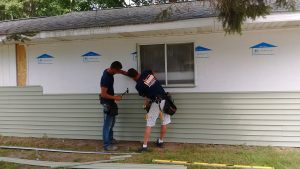 LaLonde Builders working on residential vinyl siding project